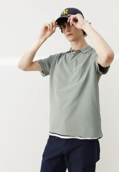 polo loom coton bio vert pâle mains face