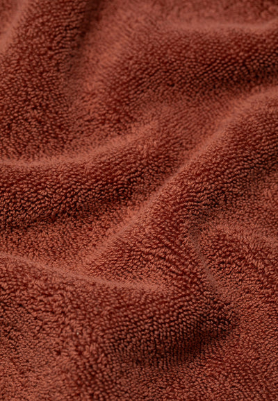 la serviette de bain terracotta détail matière.webp